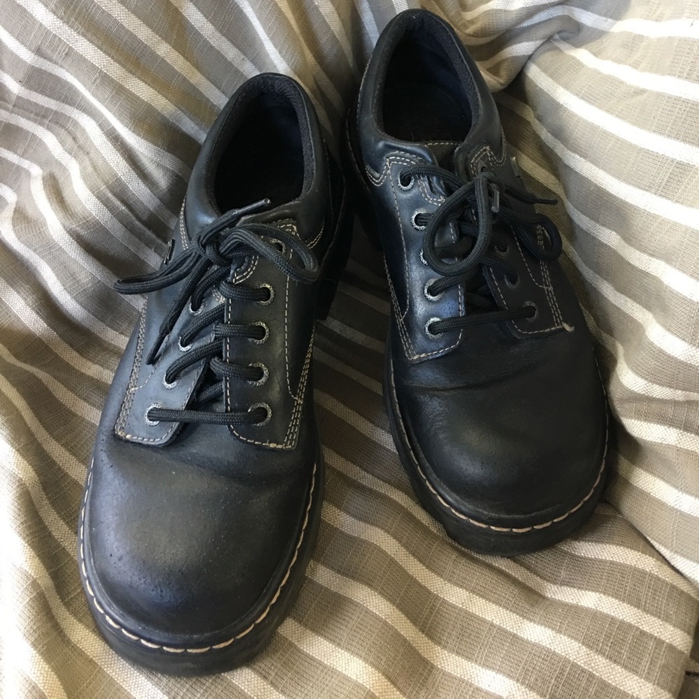 Women’s black leather Sketcher oxfords.